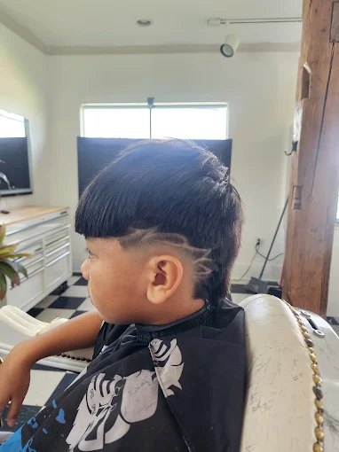A young client's freshly cut hairline, sharp and clean.